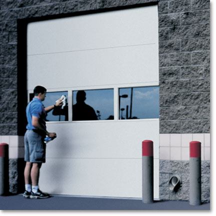 a service man working on a garage door opener repair in portland, oregon